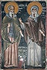Преподобные Максим Исповедник и Иоанн Дамаскин и коленопреклоненная фигура Шота Руставели. Роспись кафоликона. XVI в.
